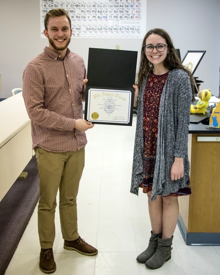 Delta-Psi President Seth Reid presents Katie Allison with her Phi Alpha Theta certificate of membership on February 27, 2018. Photo by Janelle Vest