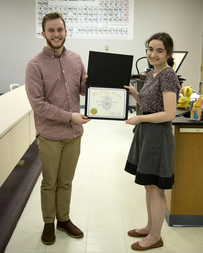 Leah Atkins accepts her Phi Alpha Theta certificate of membership from Delta-Psi President Seth Reid on February 27, 2018. Photo by Janelle Vest