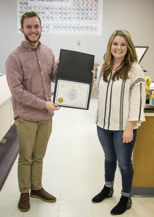 Delta-Psi President Seth Reid presents a Phi Alpha Theta membership certificate to Alex Barger on February 27, 2018. Photo by Janelle Vest