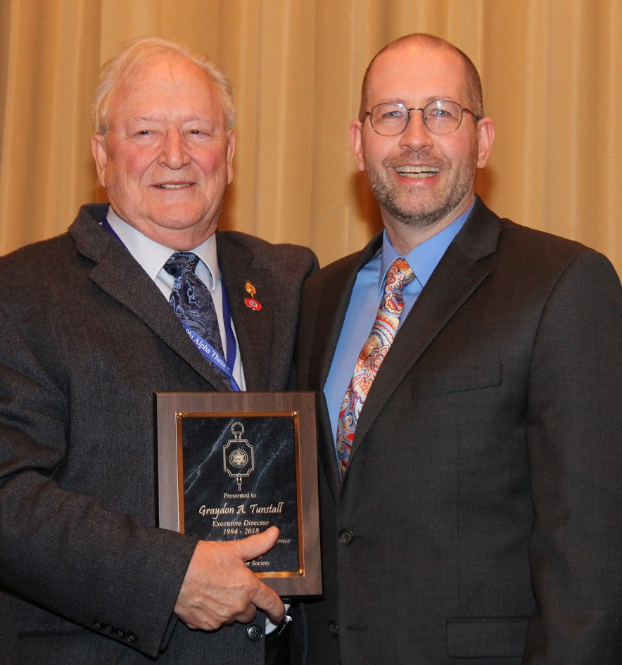 Phi Alpha Theta Executive Director Graydon Tunstall (left) and President Jochen Burgtorf pause for a photo during a plaque presentation ceremony on January 6, 2018, honoring Tunstall's 24 years of service to the organization. The ceremony took place during the society's Presidential Banquet attended by some 200 people.
