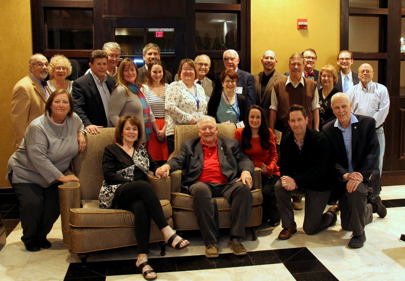 Attendees at a dinner in honor of retiring Phi Alpha Theta Executive Director Graydon Tunstall (seated with his wife Wendy in the chairs) gather for a photo at the beginning of the evening on January 5, 2018. Dr. Stephen Carls is in the front row on the right.