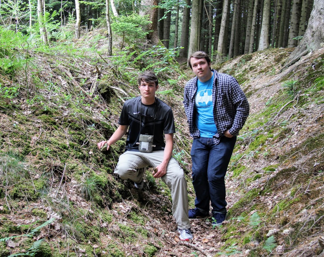 Samuel Walgren (left) and Micah Pinkley stand in an undisturbed World War I German trench near the German Crown Prince's bunker in the forest of the Haute Chevauchée near Varennes, France, on May 26, 2018.