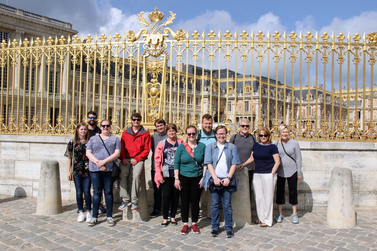 World War I tour members stand in front of the Palace of Versailles prior to their tour of the site on May 30, 2018. They are: (left to right) Ansley Moore, Christopher Ray, Susannah Murphine, Samuel Walgren, Micah Pinkley, Jeanne Reed, Emily Hedges, Alex Carr, Mary Long, Rick Rickard, Ronda Rickard, and Wendy Lay.