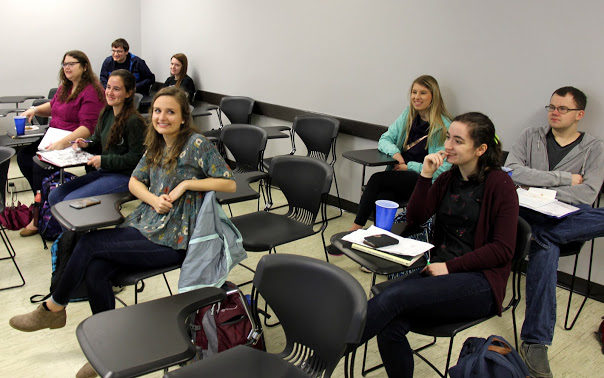 Rutledge Honorary History Club members listen as President Ali Renckens talks about the design for the club's planned T-shirts on March 19, 2018. They are: (front row, left to right) Jessica Barton, Joanna Butcher, Emily Croft, and Leah Atkins; (back row, left to right) Miles Randall, Davina Norris, Addison Osborne, and Will Choate.
