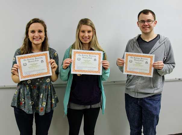 Emily Croft (left to right), Addison Osborne, and Will Choate show off their Rutledge Honorary History Club membership certificates following their initiation on March 19, 2018.