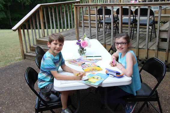 Colin and Rachel Bates work on their artistic skills at the Phi Alpha Theta cookout on May 12, 2018.