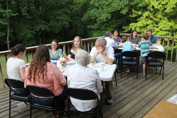 Attendees at the history department cookout on May 12, 2018, enjoy beautiful weather, good food, and great conversation together.