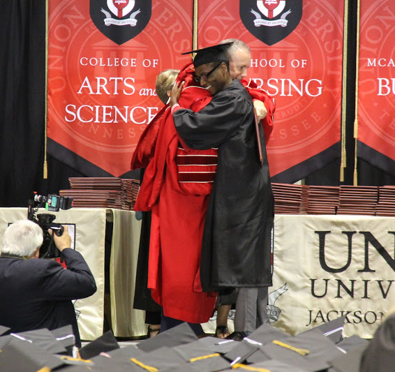 Union University President Dr. Samuel W. Dub Oliver congratulates graduating history major Cedric Davis at the school's spring commencement exercises on May 19, 2018.