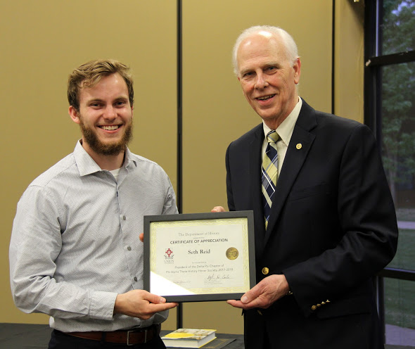 Dr. Stephen Carls (right) presents a certificate of appreciation to Seth Reid at the history awards banquet on May 3, 2018, for his work as president of Union's Delta-Psi chapter of Phi Alpha Theta in 2017-2018. Photo by Katherine Cheshire