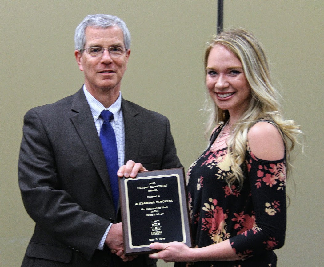 Dr. David Thomas presents a History Minor Award to Ali Renckens at the history awards banquet on May 3, 2018. Photo by Katherine Cheshire