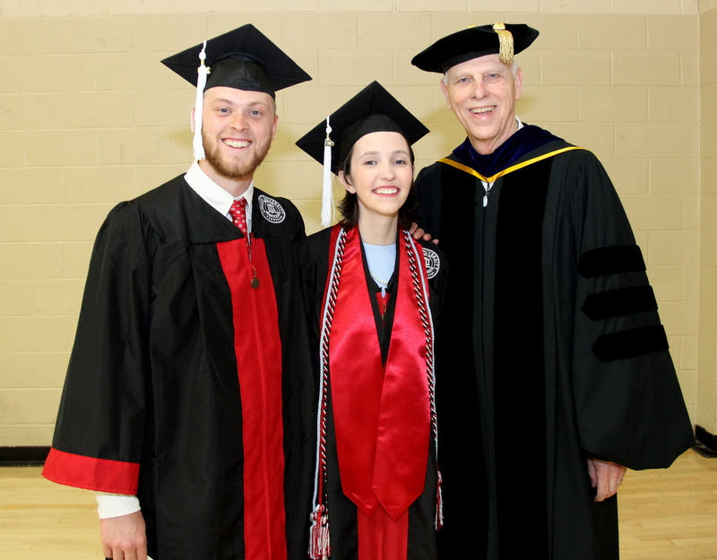 Dr. Stephen Carls (right) stands with graduating history majors Avery Parks and Lauren Butler prior to Union's spring undergraduate commencement service on May 18, 2019.