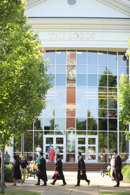Graduating seniors pass by The Logos during the processional of Union University's undergraduate commencement on May 18, 2019. Photo by Kristi Woody