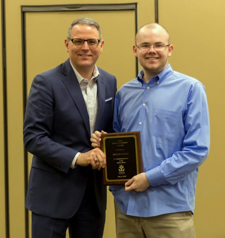 Will Choate (right) accepts the History Minor Award from Dr. Keith Bates at the history awards banquet on May 2, 2019. Photo by Nicole Grim