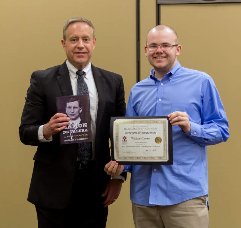 Will Choate (right) receives a certificate of recognition and a book from Dr. Henry Allen at the History Department Awards Banquet on May 2, 2019, for his paper presentation at the Tennessee Phi Alpha Theta Regional Conference at Belmont University in March. Photo by Nicole Grim