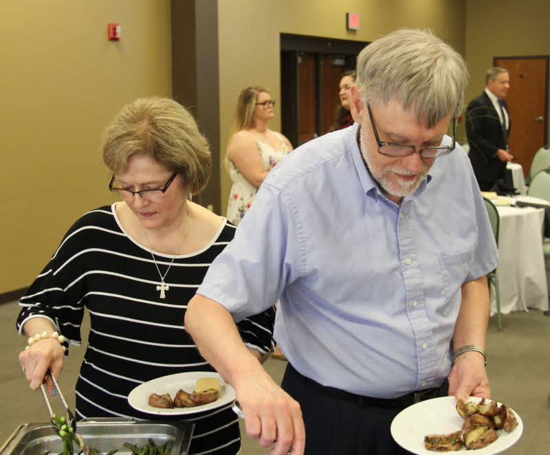 Becky Lindley and Dr. Terry Lindley go through the food line at the History Department Awards Banquet on May 2, 2019.