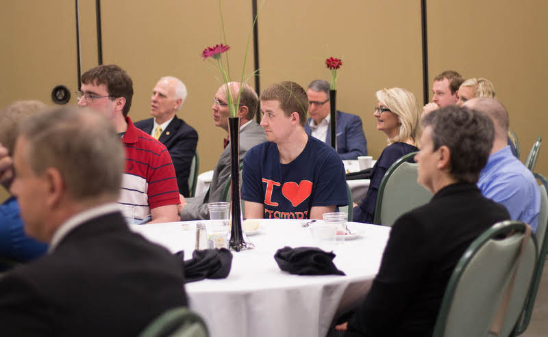 Reagan Smith (center) listens to Dr. Ray Van Neste's talk about the relevance of history in modern-day society at the History Department Awards Banquet on May 2, 2019. Photo by Nicole Grim
