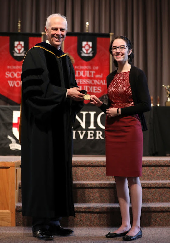 Lauren Butler accepts Union University's Academic Excellence Medal in History from Dr. Stephen Carls at the school's Annual Awards Convocation on May 3, 2019. Photo by Kristi Woody