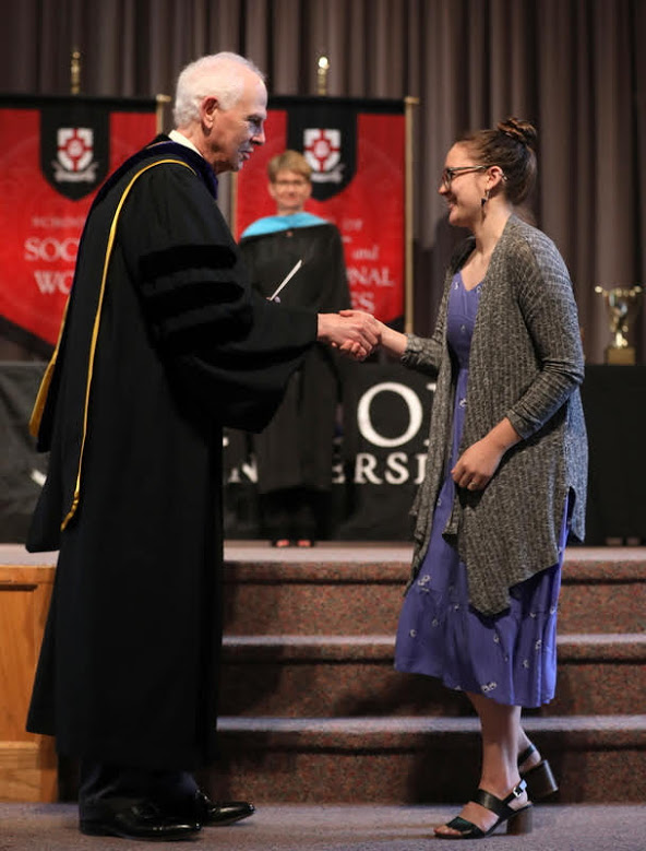 Katlyn Allison accepts congratulations from Dr. Stephen Carls at Union University's Annual Awards convocation on May 3, 2019, for winning the first-place award in the 2019 Dr. James Alex Baggett History Research Paper Competition. Photo by Kristi Woody