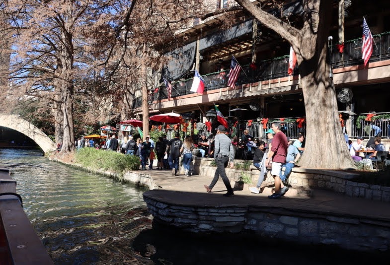 One of the scenes that Union University participants in boat cruise along San Antonio's River Walk saw on January 4, 2020, is of people enjoying the Walk's picturesque setting.