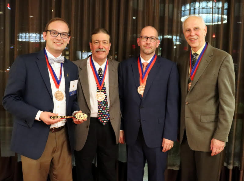 Recipients of the newly created honor of Deans of Phi Alpha Theta stand together following the Presidential Banquet at the society's biennial convention on January 4, 2020. They are Drs. Jacob Blosser (left to right), Clayton Drees, Jochen Burgtorf, and Dr. Stephen Carls. Blosser began his presidential term at the end of the banquet, while the other three previously served as president.