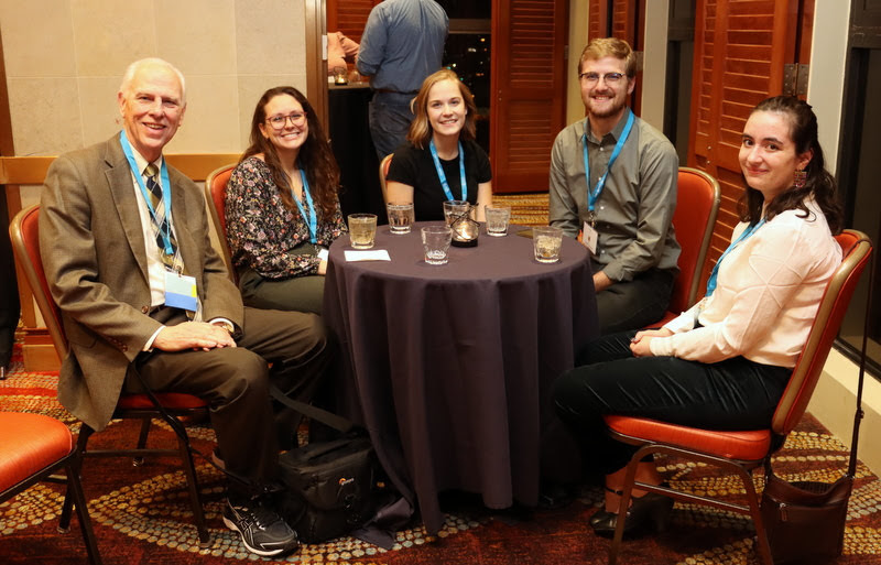 Dr. Stephen Carls (left to right), Katie Allison, Megan Ledbetter, Luke Sower, and Leah Atkins attend the opening reception of the Phi Alpha Theta Biennial Convention on January 2, 2020.