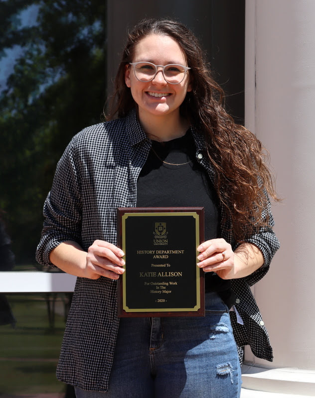 Graduating history major Katie Allison holds her History Major Award on April 30, 2020.