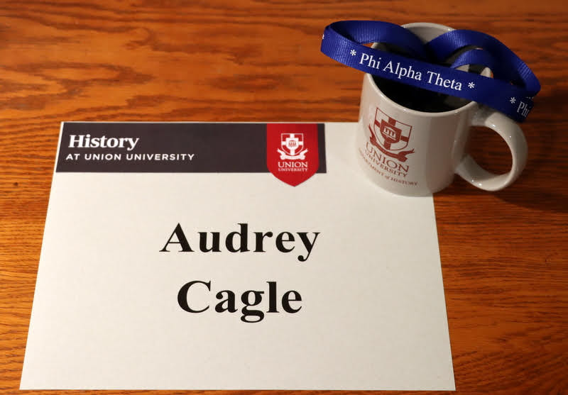Graduating history major Audrey received a Phi Alpha Theta honor cord and a history department mug in the mail in May 2020.