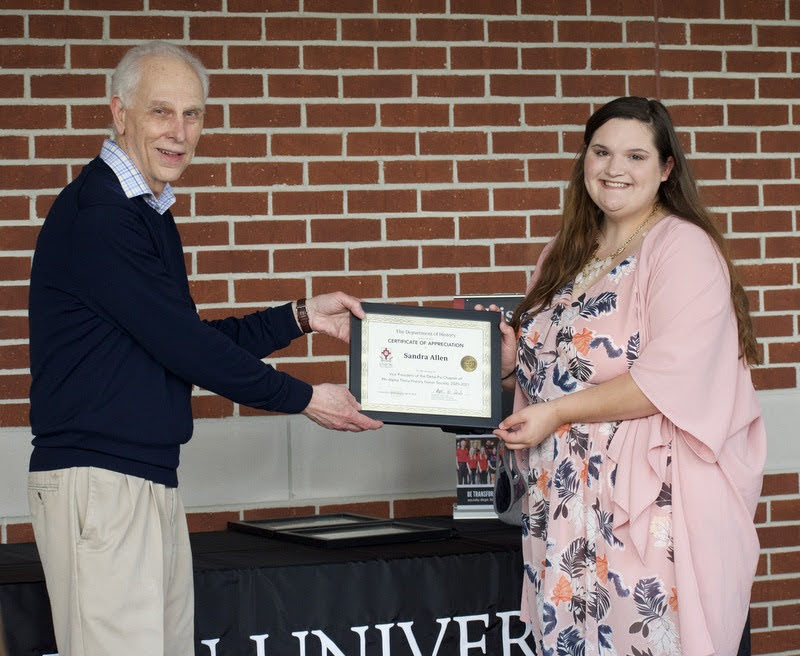 Dr. Stephen Carls gives a certificate of appreciation to Sandra Allen on April 29, 2021, for her service as vice president of the Delta-Psi chapter of Phi Alpha Theta History Honor Society in 2020-2021. Photo by Naomi Mengel