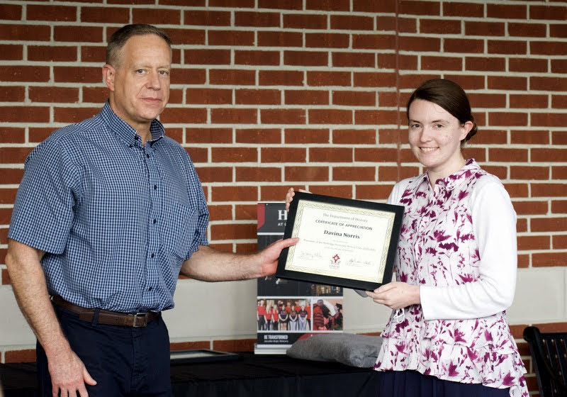 Dr. Henry Allen presents a certificate of appreciation to Davina Norris on April 29, 2021, for her work as president of the Rutledge Honorary History club in 2020-2021. Photo by Naomi Mengel