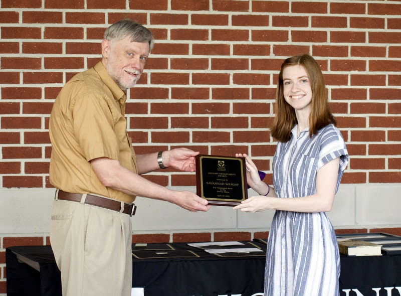 Savannah Wright accepts a History Major Award from Dr. Terry Lindley at the History Awards Program on April 29, 2021. Photo by Naomi Mengel