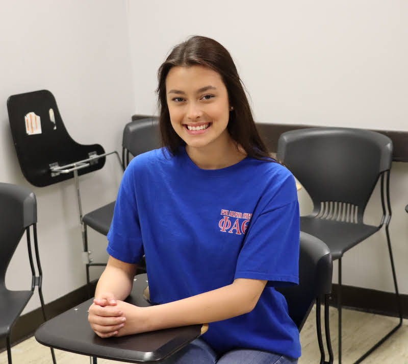 Delta-Psi chapter member Makayla wears her Phi Alpha Theta T-shirt in class for the chapter's Phi Alpha Theta T-shirt Spirit Day on April 11, 2022.