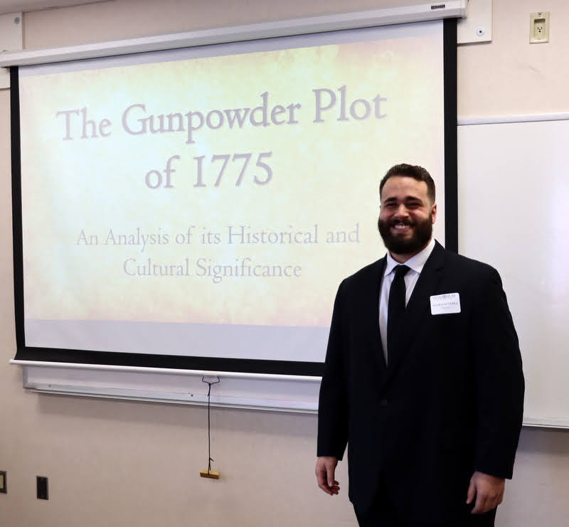 History major Nicholas Terra takes a break from preparations for his paper presentation on The Gunpowder Plot of 1775 at the Union University Scholarship Symposium on April 19, 2022.