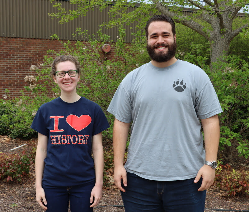 Anne Adams and Nicholas Terra stand together at the Delta-Psi chapter's Phi Alpha Theta T-shirt Spirit Day on April 11, 2022. They presented history papers virtually at the Arkansas  Phi Alpha Theta Regional Conference at Harding University on April 2, 2022.
