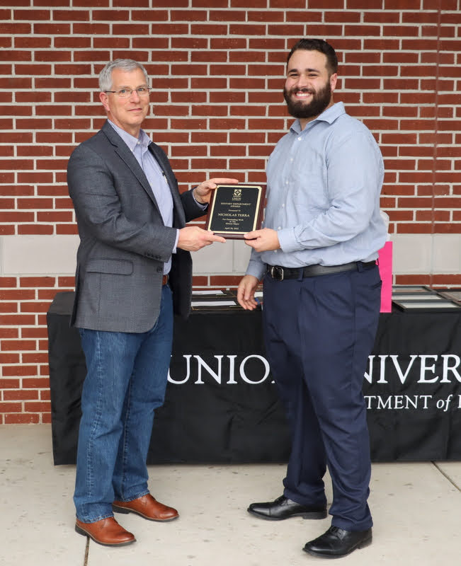 Nicholas Terra (right) receives a History Major Award for his excellent work in his history classes at Union from Dr. David Thomas at the History Department Awards Program on April 28, 2022.