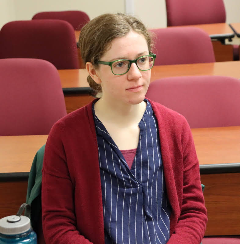 Phi Alpha Theta member Anne Adams watches the Phi Alpha Theta membership induction ceremony at the Delta-Psi chapter's spring initiation/plenary meeting on February 28, 2022. Photo by Stephen Carls