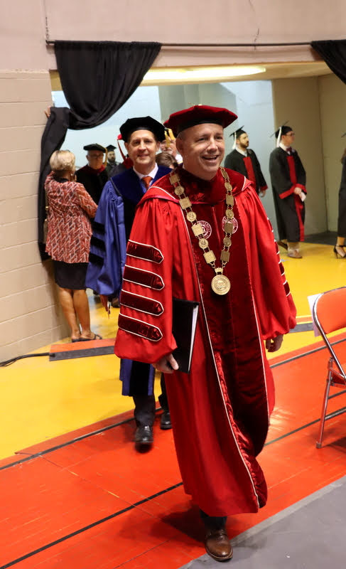 Union University President Dr. Samuel W. Dub Oliver leads the administrative side of the academic processional for Union's undergraduate commencement at the Oman Arena on May 21, 2022. Immediately behind him is United States Senator Ben Sasse of Nebraska, the  commencement speaker.