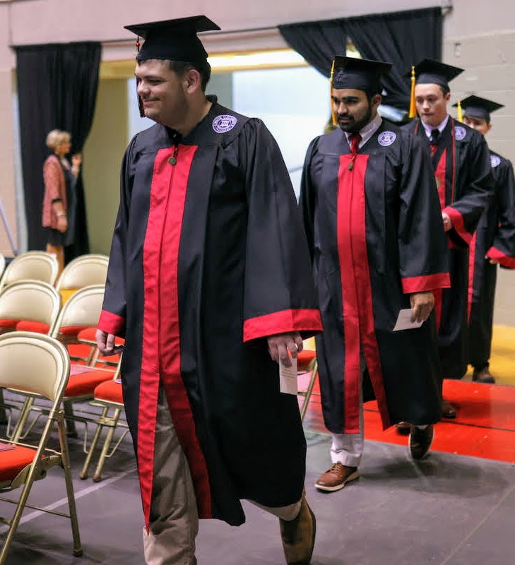 Graduating history major Dalton Lefave (lead student in photo) participates in the academic processional for the undergraduate commencement on May 21, 2022. Photo by Suzanne Rhodes