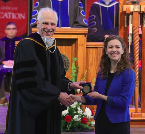 Dr. Stephen Carls presents the Academic Excellence Medal in History to Anne Adams at the Union University Awards Convocation on May 6, 2022. Photo by Suzanne Rhodes