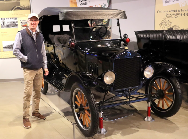 Robert Briley stands by a 1923 Ford Model T in the Transportation Gallery at Discovery Park in Union City on April 1, 2023.