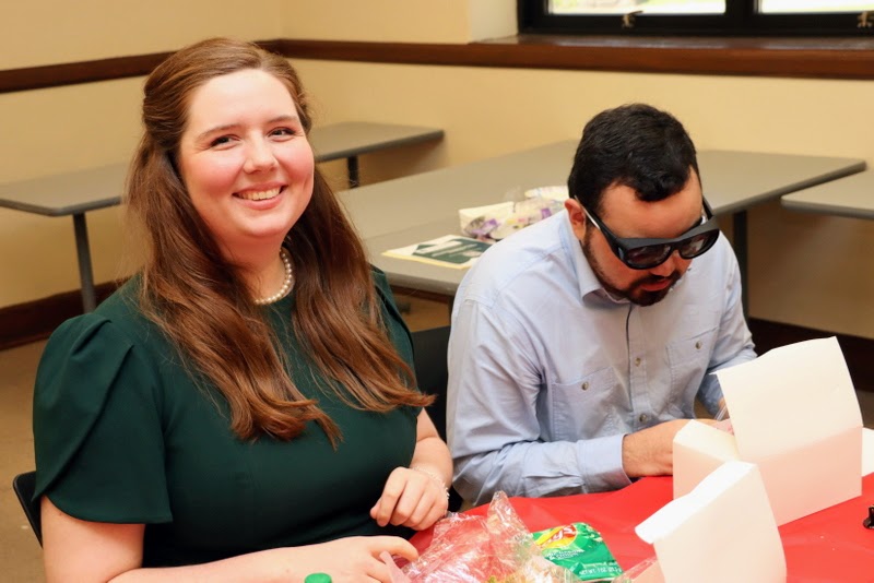 Delta-Psi chapter members Abigail Gilbert and Christian Young enjoy their box lunches at the Kentucky Phi Alpha Theta Regional Conference on April 15, 2023.
