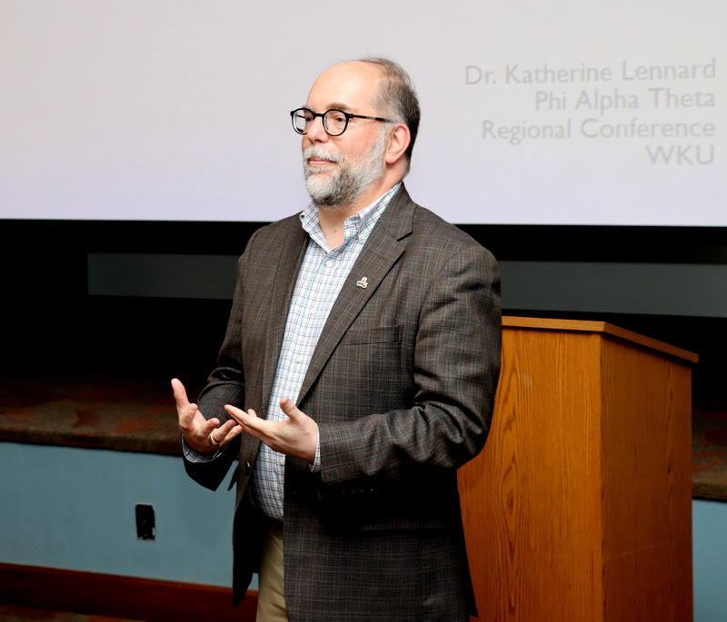 David Serafini, the history department's advisor to Western Kentucky University's Eta-Pi chapter, welcomes attendees to the conference at the start of the plenary session on April 15, 2023.