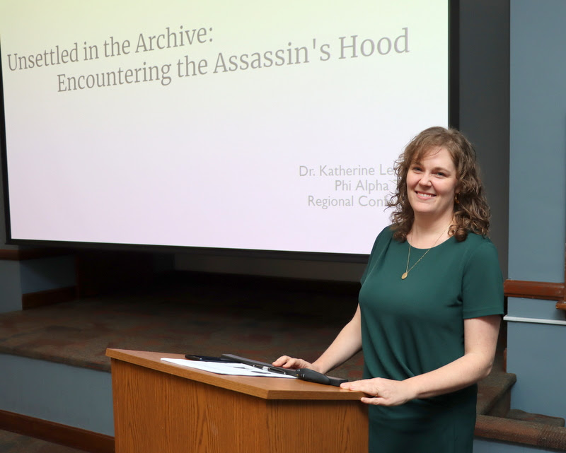 Dr. Katherine Lennard, the incoming Frockt Family Chair of Civil War Studies at Western Kentucky University, prepares to deliver her plenary lecture on Unsettled in the Archive: Encountering the Assassin's Hood at the Kentucky Phi Alpha Theta Regional Conference on April 15, 2023.