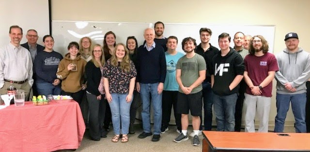 Attendees at the surprise retirement party for Dr. Stephen Carls pose for a photo at the party's end. They are (left to right) Dr. Sean Evans, Dr. Keith Bates, Joy Brown, Sophia Keskeys, Grace Sarver, Katie King, Abigail Gilbert, Breanna Edmiston, Makayla Baker, Dr. Stephen Carls, Dr. Phil Davignon, Austin Alexander, Jonathan Sanders, Jacob Frederick, Noah Kea, Dr. Henry Allen, Dr. David Thomas, Nicholas Palmer, and John Garland.