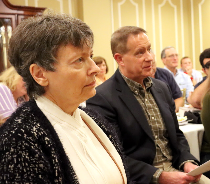 Dr. Alice-Catherine Carls and Dr. Henry Allen listen to Dr. Keith Bates pay tribute to retiring colleague Dr. Stephen Carls at the History Department Awards Banquet on April 27, 2023.