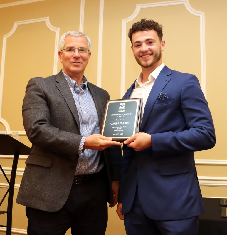 Adren Pearce (right) receives the History Minor Award from Dr. David Thomas at the History Department Awards Banquet on April 27, 2023 for excellent work in the history minor.