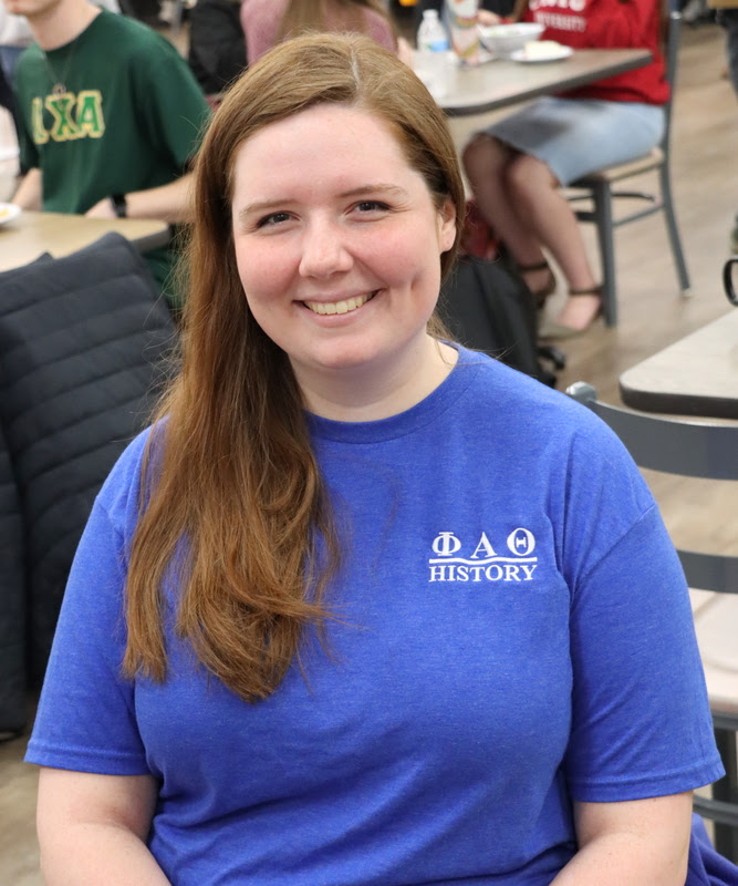 Delta-Psi chapter member Abigail Gilbert wears her Phi Alpha Theta T-shirt during lunch in Union's cafeteria on March 20, 2023, as part of the chapter's Annual Phi Alpha Theta T-shirt Spirit Day.
