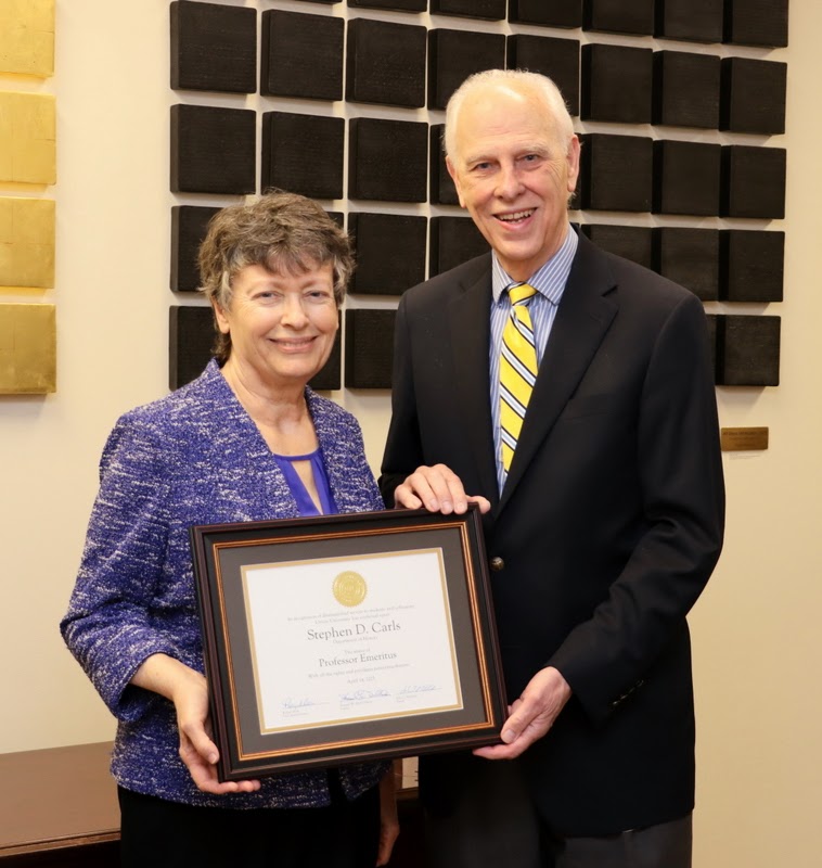 Dr. Stephen Carls is joined by his wife Dr. Alice-Catherine Carls in displaying on May 5, 2023, the professor emeritus diploma that Union University gave to him this spring.