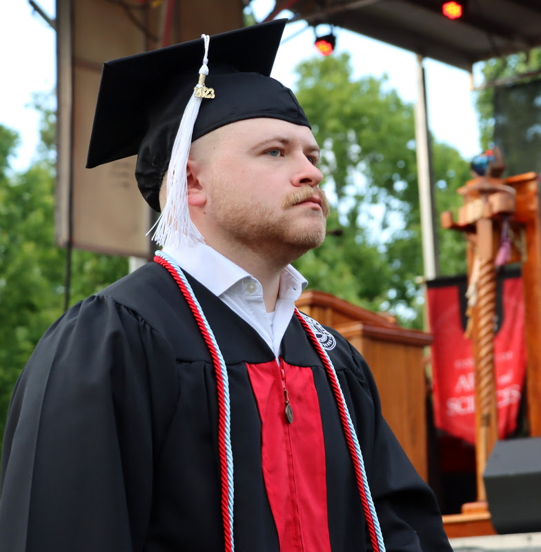 Phi Alpha Theta member John Garland waits his turn to receive his diploma at Union University's spring graduation on May 6, 2023, for finishing a Bachelor of Arts program.