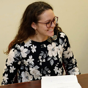 Phi Alpha Theta member Katie Allison enjoys a light moment at her history honors thesis defense on December 9, 2019.