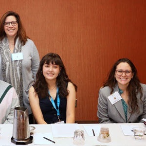 Members of the Phi Alpha Theta convention panel called “Gender/Sexuality” pose for a photo prior to their session on January 3, 2020. They are (seated, left to right) Allison Draheim, Kendra Garcia, Alondra Morillon, and Katie Allison. Dr. Tiffany Fink (panel chair/commentator) stands behind the student presenters.